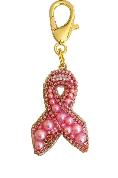 Colgante para bolso con lazo rosa.